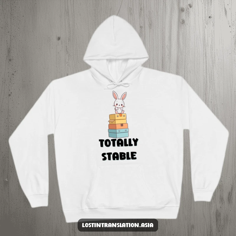 Funny rabbit teetering on a stack of mystery boxes printed on a comfortable hoodie, perfect for gifting.
